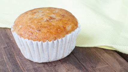 Homemade cupcake banana on the wooden table