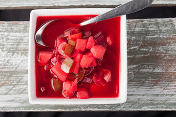 Homemade vegetable beet soup Borscht top view on a weathered barn wood table