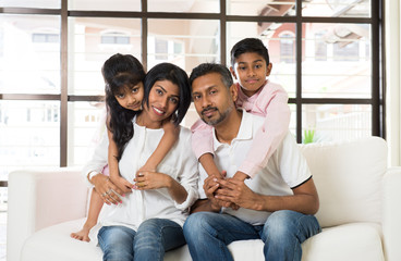 happy indian family at living room