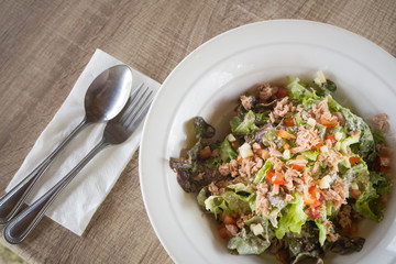 Dining table with Tuna salad and vegetables