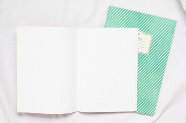 opened blank polka dot notebook