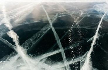 Trace of studded bike tires on the black ice