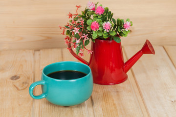 cup and vase on wood table