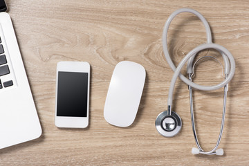 Stethoscope in doctors desk. View from above