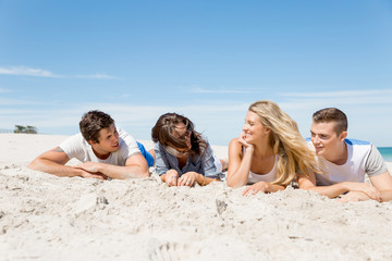 Fototapeta premium Company of young people on the beach