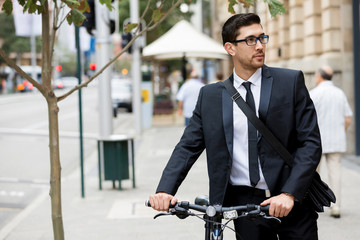 Young businessmen with a bike