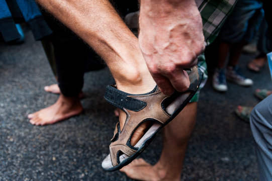 detail of bare feet during bare foot march in favour of refugees in rome
