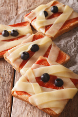 Halloween food: sandwiches mummy close up. vertical
