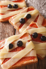 terrible sandwiches for Halloween in the form of a mummy macro. vertical
