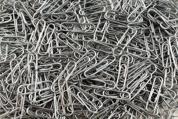 A close up image of metal paper clips