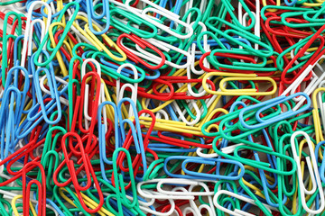 A close up image of multicolored paper clips