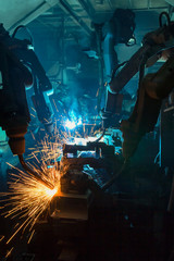Robots welding automotive part