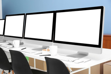 Row of computers in office