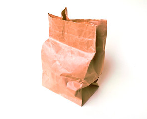 Brown paper bag on white.