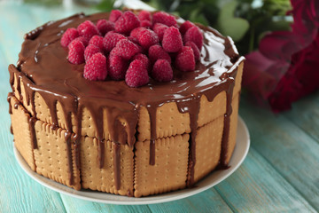 Cookie cake with melted chocolate and raspberries