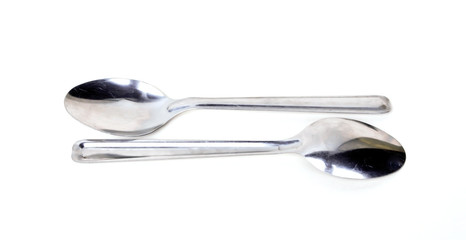 Metal spoon on a white background