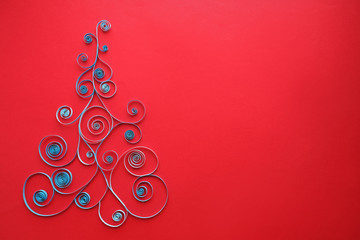 Paper Christmas tree on red background