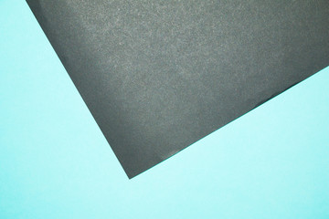 Blue and black paper background.