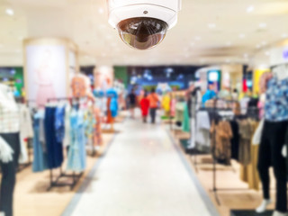 CCTV Security camera shopping department store on background.