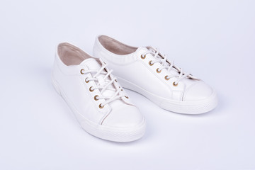 Women's sport leather shoes on white background