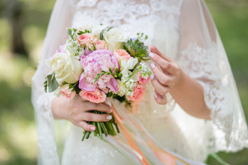 Bride or bridemaid with bouquet, closeup