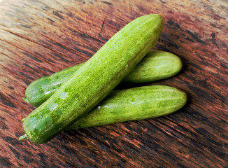 Cucumbers on a wooden background.