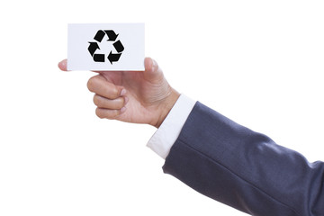 Man hand show recycle logo on business card. 