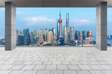 abstract architectural column with city skyline background,shanghai,china.