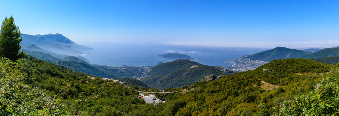 Fototapeta na wymiar A wonderful big panorama of Budva Riviera from the mountain. Sun