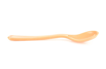 Plastic spoon on a white isolated background