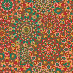 Seamless pattern with round colored mandalas.