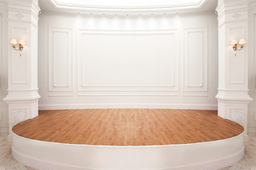 Stage of auditorium with wooden floor.