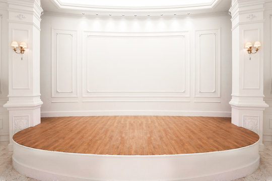 Stage of auditorium with wooden floor.