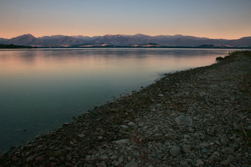 Lake Beach with Mountain Range
