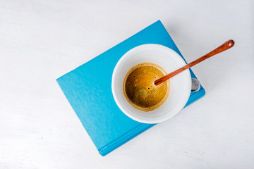 Cup of coffee  on book