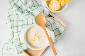 hot corn soup in a white bowl