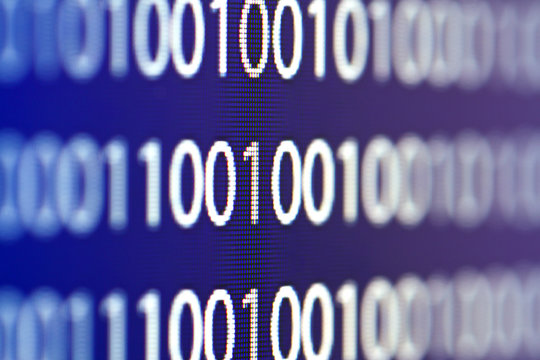  Binary code on a computer monitor blurred background
