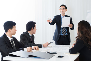 Businessman as a meeting leader asking for an opinion in the meeting