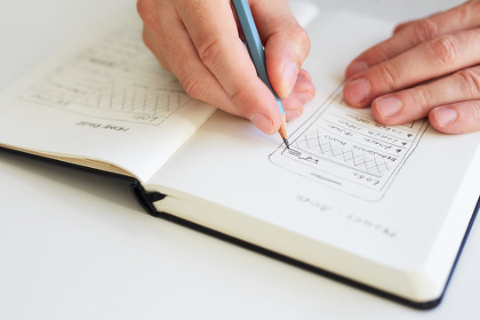 Man sketching graphic sketch in office