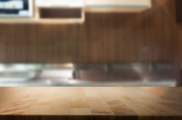 Dining table on blurred brown kitchen interior background