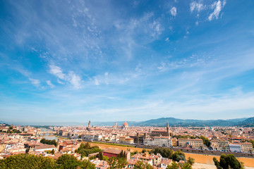 Florence aerial cityscape view from Michelangelo square on the old town with famous cathedral church and river in Italy. General plan with copy space