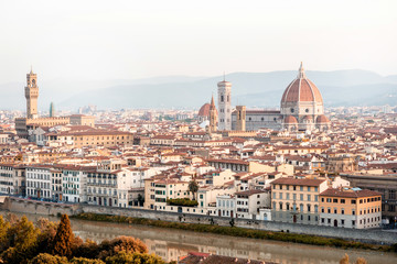 Florence aerial cityscape view from Michelangelo square on the old town with famous cathedral church and river in the morning in Italy
