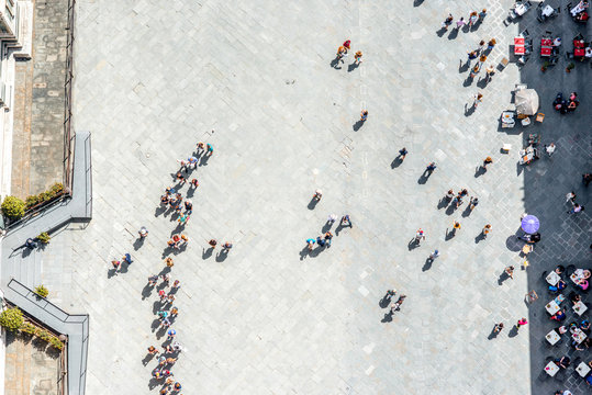 Top View On Cathedral Square With People Line To The Bell Tower Of Duomo In Florence