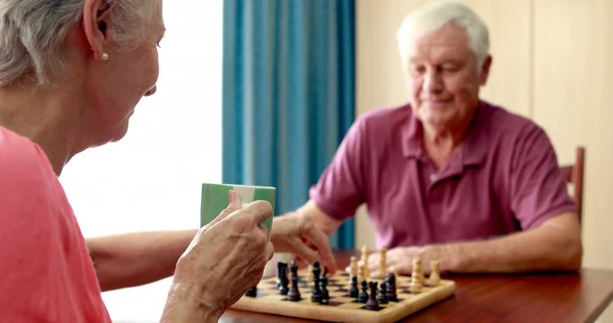 Senior couple playing chess - Powered by Adobe