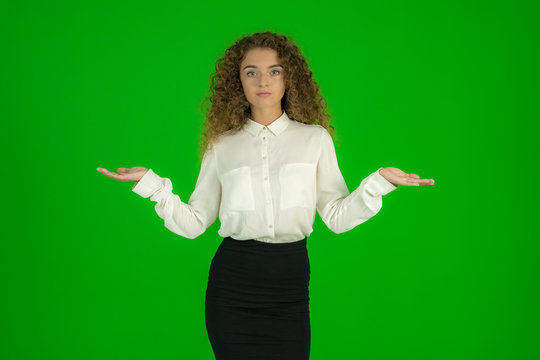 The young woman stand on the green background