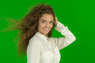 The beautiful woman stand on the green background