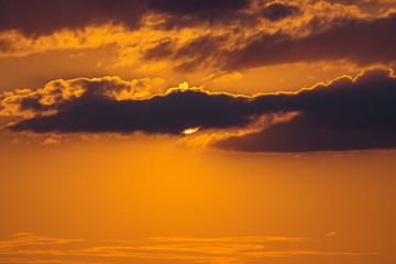 The beautiful flow of rainy cloud against the background of sunset