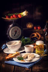 Bavarian sausage with pretzel, sweet mustard and beer