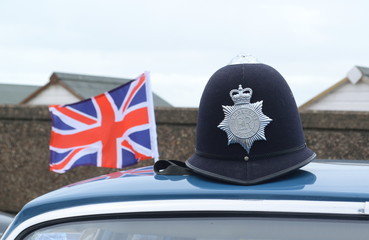 The custodian helmet with the Humberside Police badge and national flag of the United Kingdom.