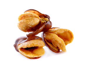 dried broad bean in spoon on white background